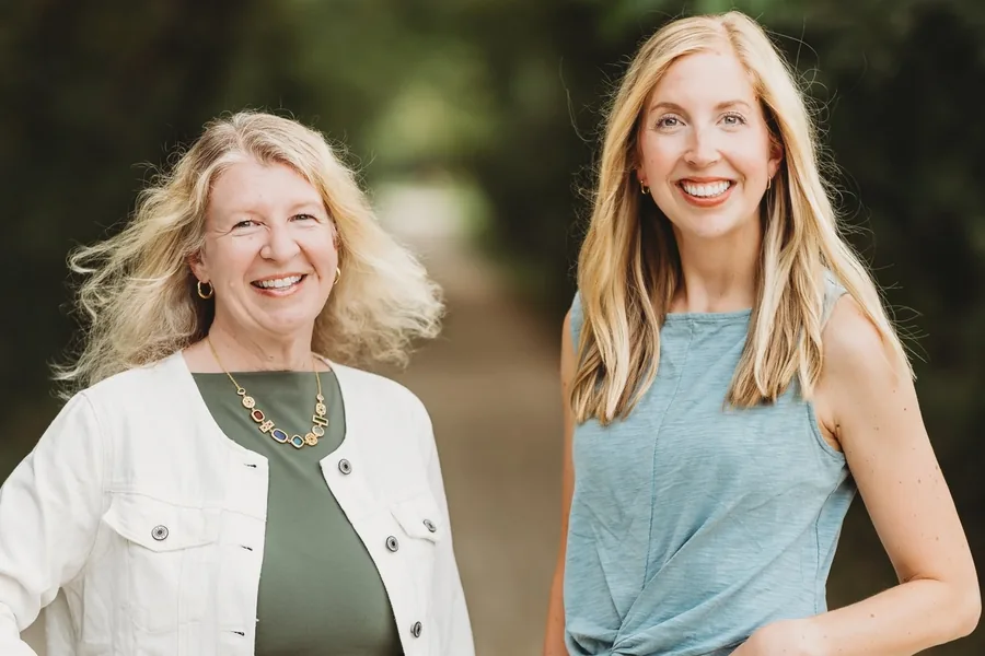 Dr. Elizabeth Phillips, left, and Dr. Lauren Neitzke, right, smiling outdoors.