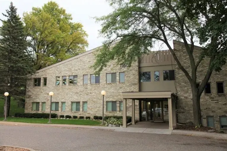 The building at 11601 Minnetonka Mills Road that houses Tonka Smiles, with trees and the entrance canopy.