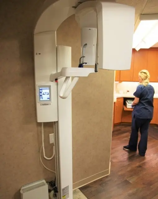 The digital imaging machine at Tonka Smiles, with a team member working nearby.